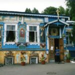 Man, freshly purged of demons, emerges from consecrated house round the corner from TGI Friday's. Kiev, Ukraine.
