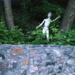 Naked boy dummy at entrance to Vidubitsky Monastery in Kiev warns strangers to flee before it's too late.
